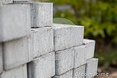 Gray paving stones piled up in a big pile. Construction site Stock Photo