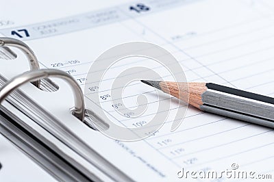 gray pencil on open business agenda Stock Photo