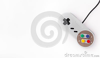 Gray retro joystick on a white background. Video game console GamePad on a white background. Copy space Editorial Stock Photo