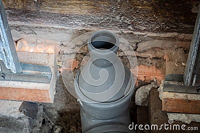Gray sewer pipes. Repair and installation. Construction works Stock Photo