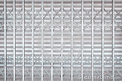 Gray or silver rolling steel door or roller shutter door in interlace patterns for background Stock Photo