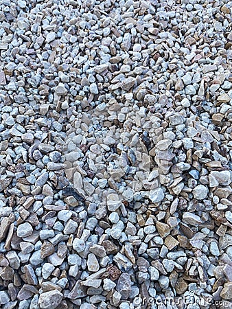 Gray small rocks ground texture. black small road stone background. Stock Photo