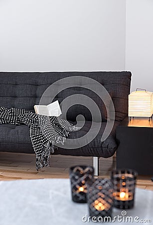 Gray sofa and cozy lights in the living room Stock Photo