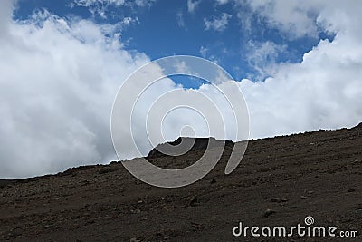 Gray soil mountain and blue smock sky Stock Photo