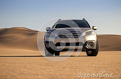 Gray Subaru in the sand of the Namib desert at a bright sky. Editorial Stock Photo