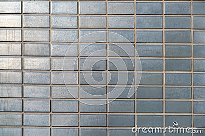 Gray vintage mosaic brick tiles wall Stock Photo