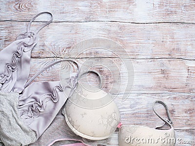 Gray woman lingerie set on wooden background Stock Photo