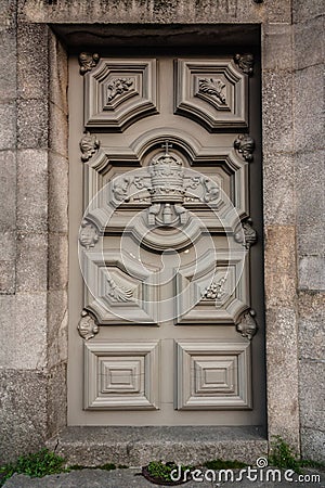 Amazing classic gray wooden door with decorative details. Front view Stock Photo