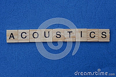 Gray word acoustics from small wooden letters Stock Photo