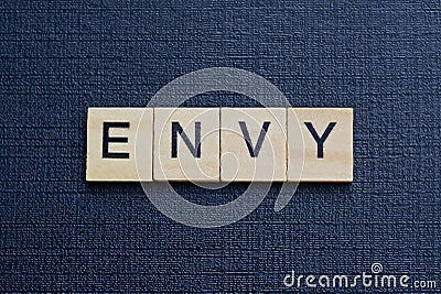 gray word envy from small wooden letters Stock Photo