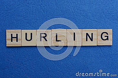 gray word hurling from small wooden letters Stock Photo