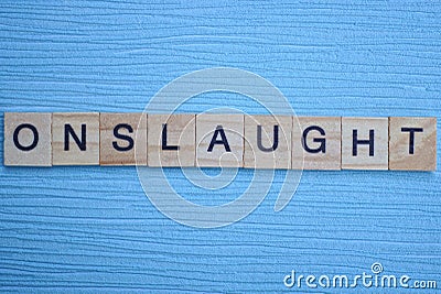 Gray word onslaught from small wooden letters Stock Photo