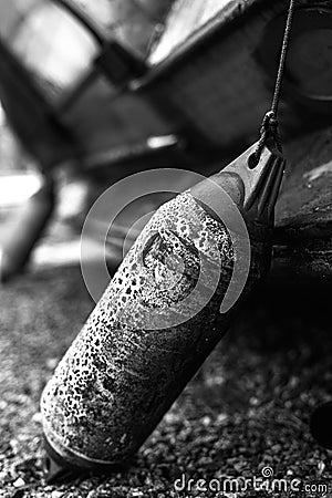 Grayscale closeup shot of the rusty old and aged boat buoy Stock Photo