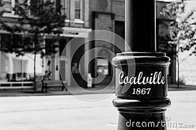 Grayscale shot of a city light pole on the quiet weekend streets of Coalville, UT Editorial Stock Photo