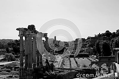 Grayscale shot of a historical scene featuringancient ruins of the Roman Forum Editorial Stock Photo