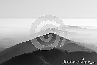 Grayscale shot of the misty Black Mountains in Wales Stock Photo