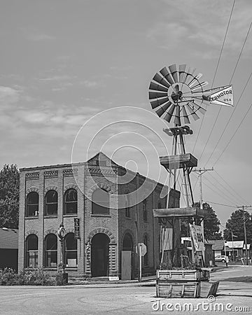 Grayscale view of a vintage wind wheel on the street of Blackwater, Missouri, USA Editorial Stock Photo