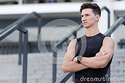 Great achievements on his mind, concentrated handsome sportsman on stairs Stock Photo