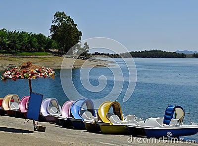 Colorful pedal boats on the Orellana beach, Badajoz - Spain Editorial Stock Photo