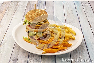 Great and beastly double burger of crispy chicken and beef with onion, Stock Photo