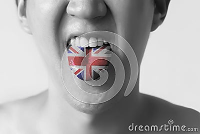 Great Britain flag painted in tongue of a man - indicating English language and British accent speaking in Black and White tone Stock Photo