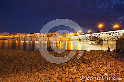 Seville at night, Spain. View of the Triana Editorial Stock Photo