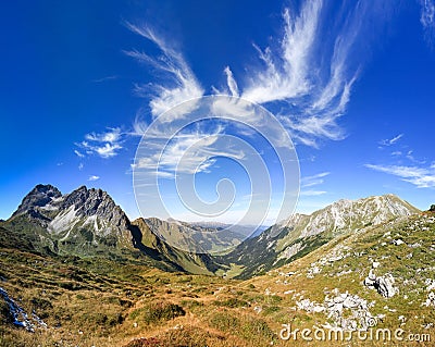 Great clear view in the mountain with beautiful clouds. Alps. Stock Photo
