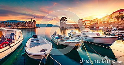 Great evening view of Gulf of Corinth, Greece, Europe. Attractive sunset on popular touristic destination - Nafpaktos port. Calm s Stock Photo