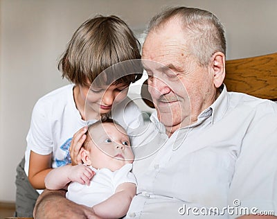 Great grandfather with grandchildren Stock Photo