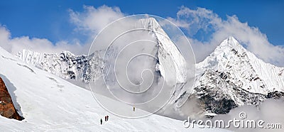 Great himalayan range hikers glacier Himalayas mountains Stock Photo