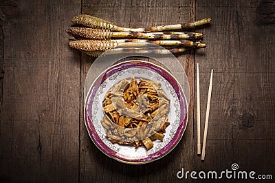 Great horsetails in plate with chopsticks Stock Photo