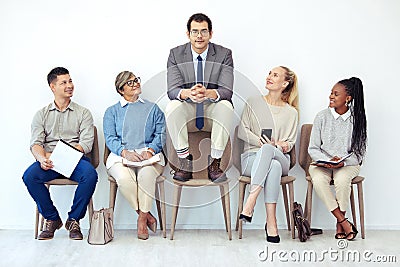 Great ideas come through collaboration. a group of people waiting to be interviewed for a job at a modern office. Stock Photo