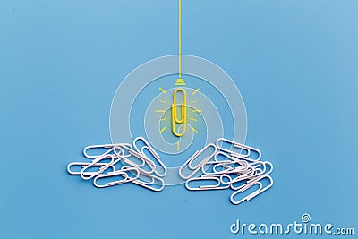 Great ideas concept with paperclip,thinking,creativity,light bulb on blue background Stock Photo