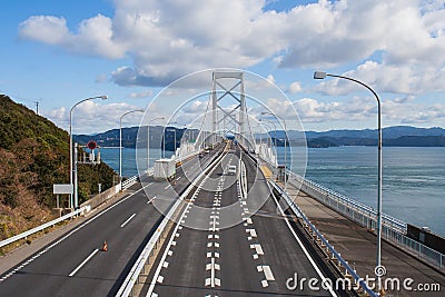 Great Naruto bridge cross over ocean. It is a large suspension bridge that stretches across the Naruto Strait. Stock Photo