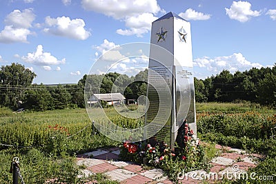 Great Patriotic War monument in a small village with rural landscape on background. Zhernovki of Ryazan region, Russia. Editorial Stock Photo