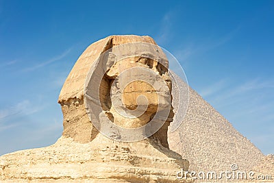 Great profile of Sphinx pyramid with the blue sky background. Stock Photo