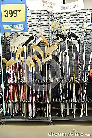 Great selection of hockey sticks in the store Editorial Stock Photo