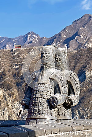 The Great Wall of China in winter. sculptures of ancient warriors on the background of the great wall. The Badaling area. Stock Photo