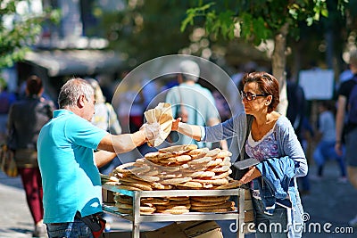 GREECE, ATHENS - OCTOBER 07, 2018 Donut seller, koulourakia, on the street in Plaka district Editorial Stock Photo