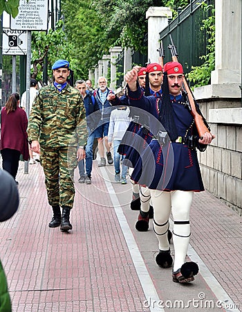 Greece, Athens: Three Presidential Guards Marching Towards the Hellenic Parliament Editorial Stock Photo