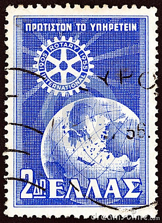 GREECE - CIRCA 1956: A stamp printed in Greece shows Rotary Emblem and Globe Editorial Stock Photo