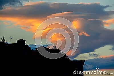 Silhouette of a Rock Monastery and Amazing Cloud Stock Photo