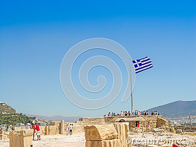 Greece flag at the Parthenon temple at the Acropoli Editorial Stock Photo