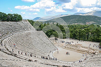 Ancient Greek amphittheater with tourists seen from the top Editorial Stock Photo