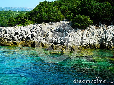 Greece rocky coasline, green, blue, turqouise, aquamarine water, mediterranean sea. Stock Photo