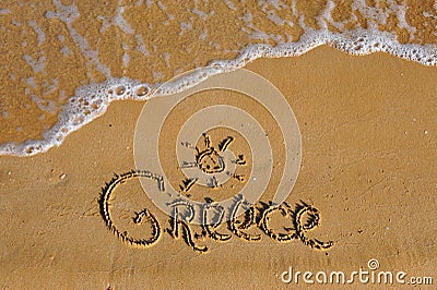 Greece word on sandy summer beach Stock Photo