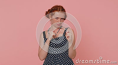 Greedy avaricious redhead young woman showing fig negative gesture, rapacious avaricious acquisitive Stock Photo