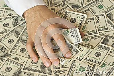 Greedy hand grabs money Stock Photo