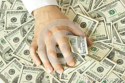 Greedy hand grabs money Stock Photo