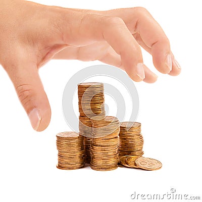 Greedy hand stretches to the coins Stock Photo